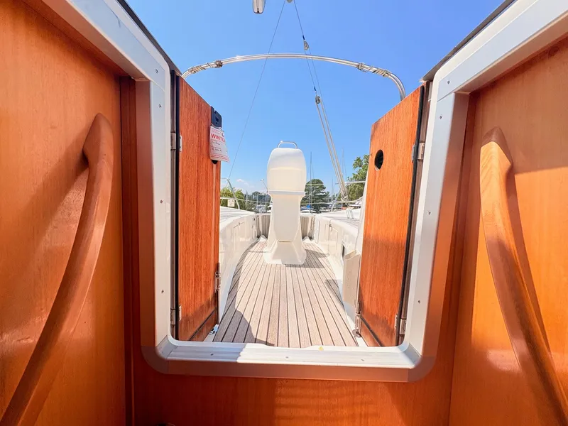 Slide: The Image of View from inside a 2008 Bavaria Cruiser 38, showing the deck with wooden paneling. - 38