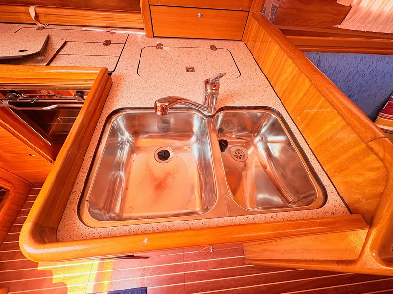 Slide: The Image of The galley of a 2008 Bavaria Cruiser 38 featuring a stainless steel double sink. - 29