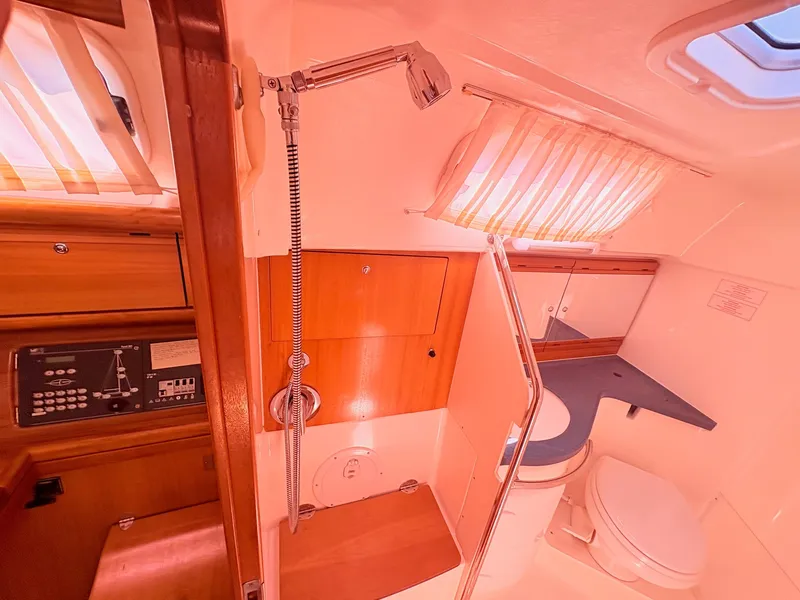 Slide: The Image of Interior of a 2008 Bavaria Cruiser 38 featuring a shower and toilet. - 22
