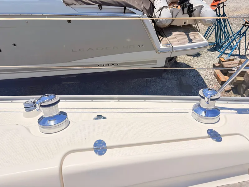 Slide: The Image of Close-up of a boat deck with winches and ropes. Another boat is visible in the background. - 13