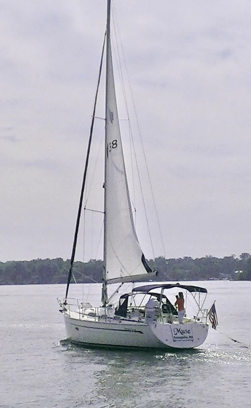 Slide: The Image of A 2008 Bavaria Cruiser 38 sails on calm water with its sail hoisted. - 0