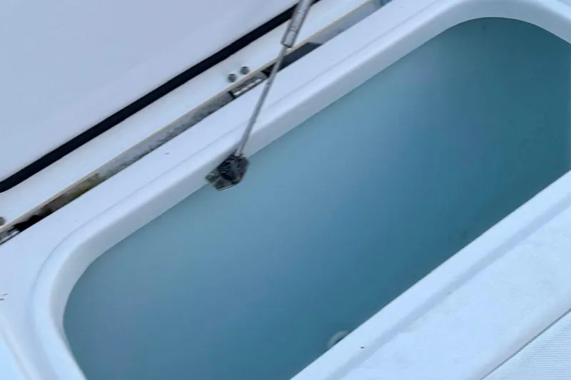Slide: The Image of Open storage compartment on a 2018 Sea Hunt Gamefish 25 boat. - 13