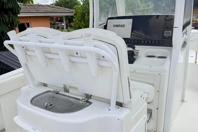 Slide: The Image of 2018 Sea Hunt Gamefish 25 boat interior with Simrad electronics and rod holders. - 7