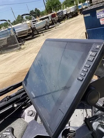 Slide: The Image of A modern navigation system on a boat, surrounded by other boats in a parking area. - 46
