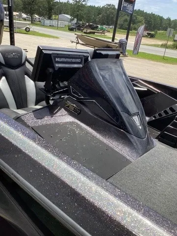 Slide: The Image of The image shows the cockpit of a 2023 Skeeter FXR21 boat with a Humminbird fish finder. - 47