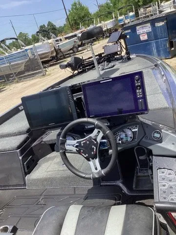 Slide: The Image of The image shows the cockpit of a 2023 Skeeter FXR21 with modern instruments and screens. - 44