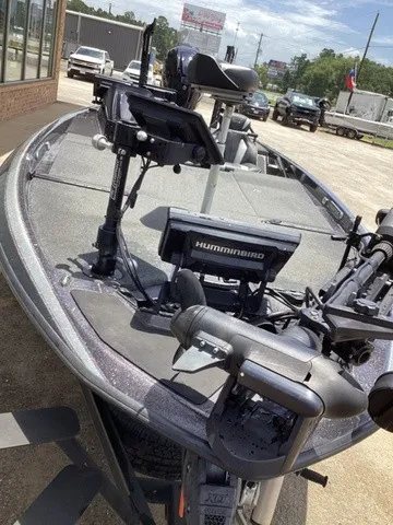Slide: The Image of The image shows a modern Skeeter FXR21 boat with advanced electronics and fishing gear. - 23