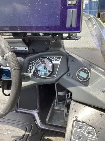 Slide: The Image of The image shows the dashboard of a 2023 Skeeter FXR21 boat with modern instruments. - 40