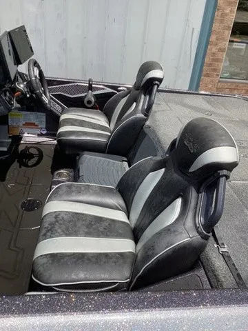 Slide: The Image of The image shows the interior of a 2023 Skeeter FXR21 boat with two cushioned seats. - 11