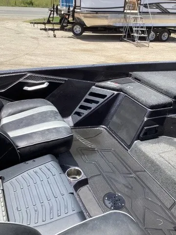 Slide: The Image of The image shows the cockpit of a 2023 Skeeter FXR21 boat with modern seating and controls. - 43