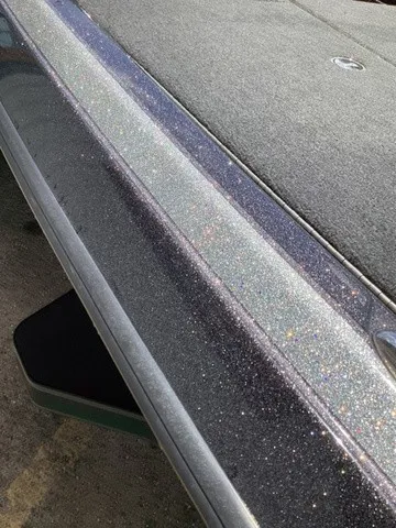 Slide: The Image of Close-up of a sleek boat deck with a sparkling finish. - 36