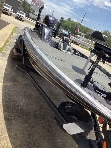Slide: The Image of A 2023 Skeeter FXR21 boat on a trailer, ready for use. - 24
