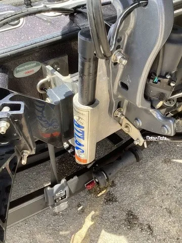Slide: The Image of Close-up of a boat trailer with shock absorber and mechanical components. - 6