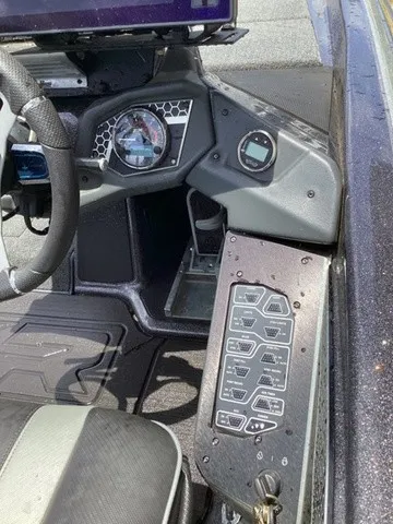 Slide: The Image of The image shows the cockpit of a 2023 Skeeter FXR21 boat with modern instruments and controls. - 39