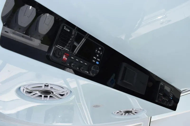 Slide: The Image of Control panel and speakers on a 2027 Contender 39 ST boat. - 29