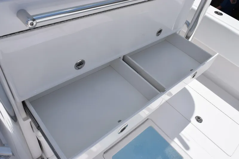 Slide: The Image of Open storage compartments on a 2027 Contender 39 ST boat, showcasing sleek design and functionality. - 43