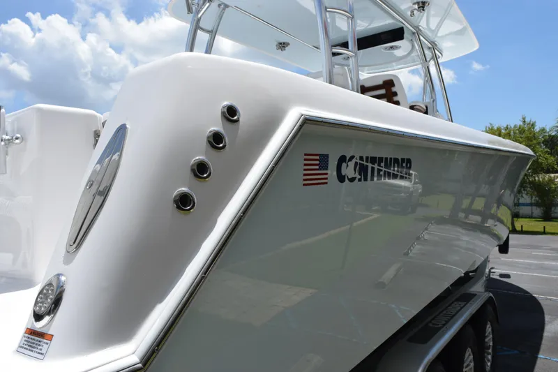 Slide: The Image of 2027 Contender 39 ST boat with sleek design and American flag logo. - 6
