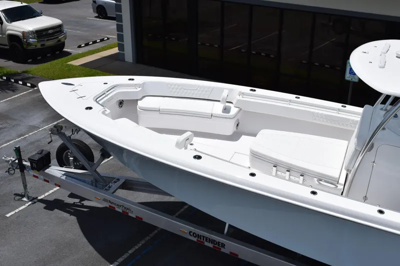 Slide: The Image of Contender 39 ST 2027 boat on trailer, parked in a lot, showcasing sleek design. - 10