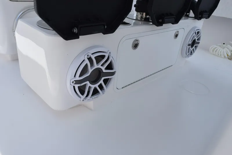 Slide: The Image of Contender 39 ST 2027 boat console with speakers and storage compartment. - 23