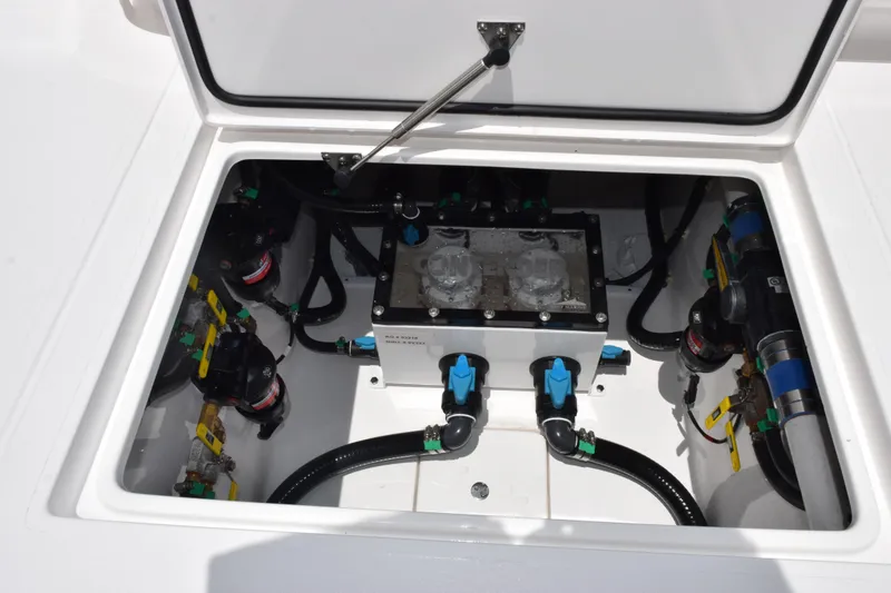 Slide: The Image of Contender 39 ST 2027 boat compartment with mechanical components and wiring. - 47
