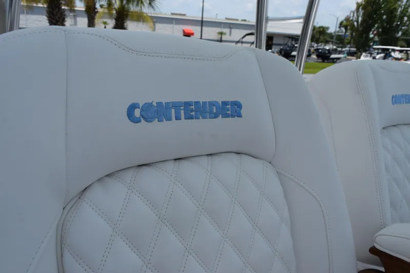 Slide: The Image of White leather seats with "Contender" logo on a 2027 Contender 39 ST boat. - 25