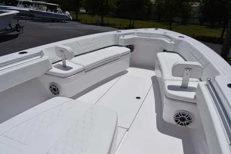 Slide: The Image of 2027 Contender 39 ST boat interior with white seating and speakers. - 22
