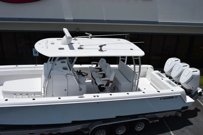 Slide: The Image of 2027 Contender 39 ST boat with triple Mercury engines, viewed from above. - 8