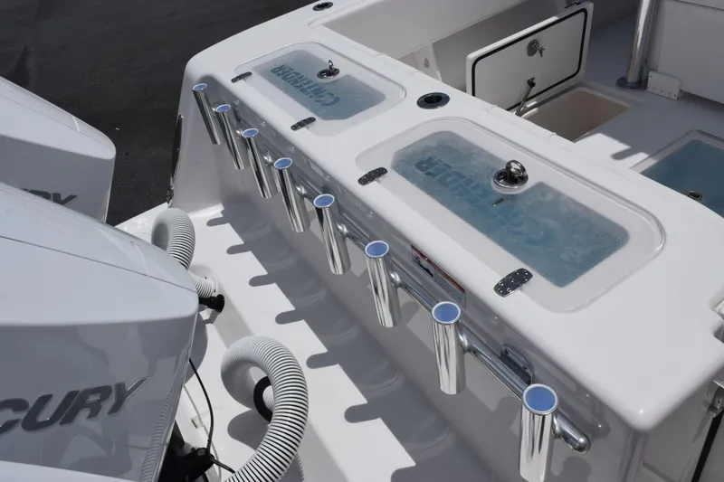 Slide: The Image of 2027 Contender 39 ST boat deck with rod holders and livewell. - 50