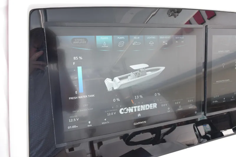 Slide: The Image of Display screen of a 2027 Contender 39 ST boat showing system controls and status. - 34