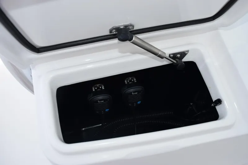 Slide: The Image of Storage compartment with communication devices in 2027 Contender 39 ST boat. - 27