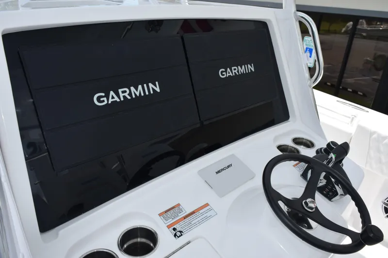 Slide: The Image of Dashboard of 2027 Contender 39 ST boat with Garmin displays and Mercury controls. - 17