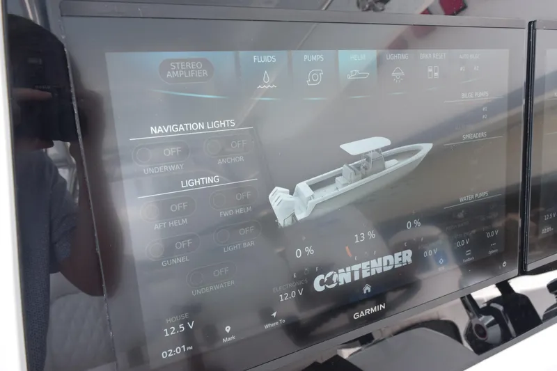 Slide: The Image of Touchscreen display of a 2027 Contender 39 ST boat showing navigation and lighting controls. - 31