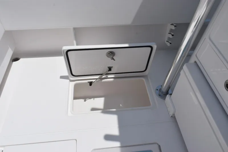 Slide: The Image of Open storage compartment on 2027 Contender 39 ST boat deck. - 44