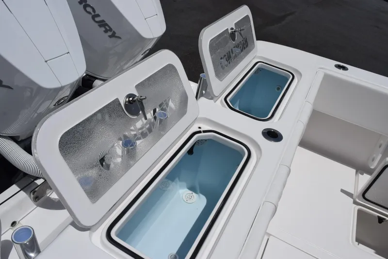 Slide: The Image of 2027 Contender 39 ST boat with open livewell compartments and Mercury engines. - 48