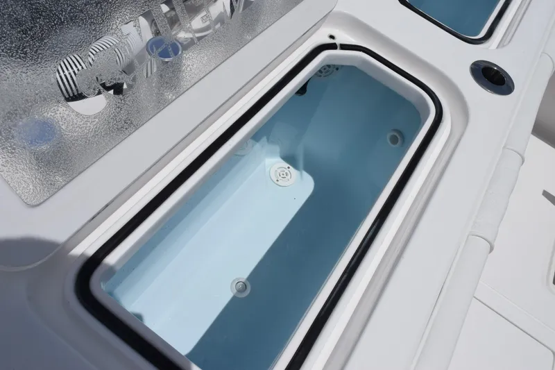Slide: The Image of Open storage compartment on 2027 Contender 39 ST boat, featuring sleek design and functionality. - 49