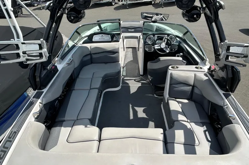 Slide: The Image of 2015 Supra SA 400 boat interior with spacious seating and modern dashboard. - 6