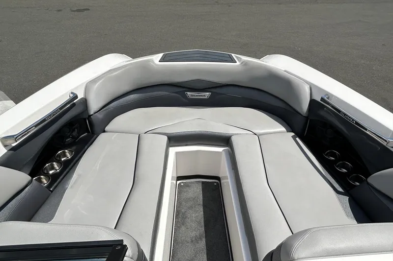 Slide: The Image of Luxurious interior of a 2015 Supra SA 400 boat with plush seating and cup holders. - 13