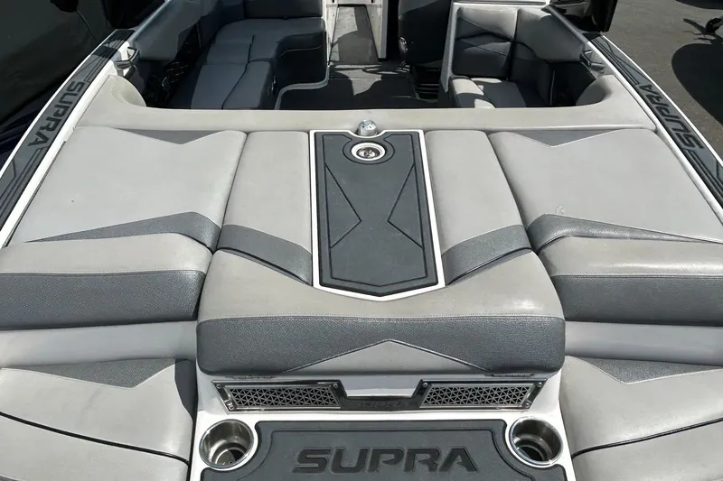 Slide: The Image of 2015 Supra SA 400 boat interior with sleek gray seating and modern design. - 5