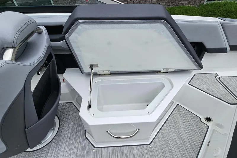 Slide: The Image of Open storage compartment on 2023 Cobalt R4 boat with sleek interior design. - 26