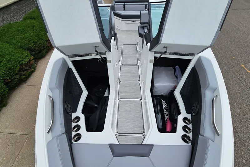 Slide: The Image of 2023 Cobalt R4 boat interior with open storage compartments and seating. - 23