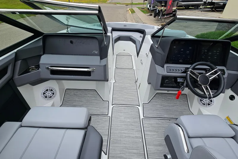 Slide: The Image of 2023 Cobalt R4 boat interior with modern dashboard and seating. - 18