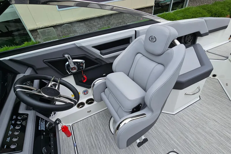 Slide: The Image of 2023 Cobalt R4 boat interior with sleek steering wheel and luxurious seating. - 15