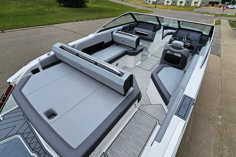 Slide: The Image of 2023 Cobalt R4 boat interior with sleek seating and modern dashboard design. - 8