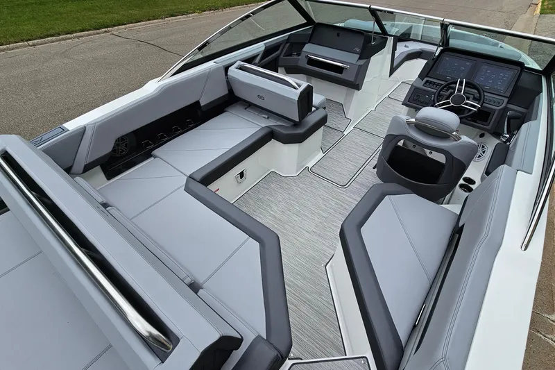 Slide: The Image of 2023 Cobalt R4 boat interior with sleek seating and modern dashboard design. - 9
