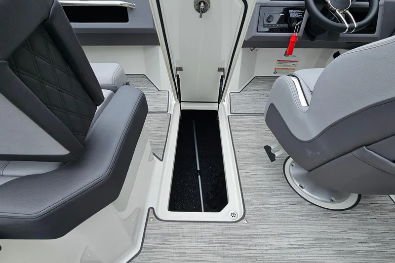 Slide: The Image of Interior of a 2023 Cobalt R4 boat, featuring seating and storage compartment. - 25