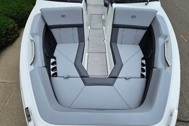 Slide: The Image of 2023 Cobalt R4 boat interior with sleek gray seating and cup holders. - 20