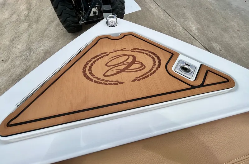 Slide: The Image of Close-up of a boat deck with a sleek wood design and an embossed logo. - 18
