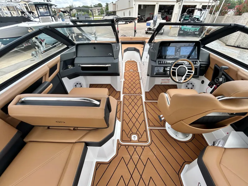 Slide: The Image of The image shows the cockpit of a 2027 Cobalt R4 boat with luxurious leather seating and modern instruments. - 33