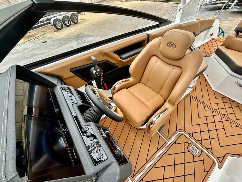 Slide: The Image of The image shows the interior of a 2027 Cobalt R4 boat with a luxurious leather seat. - 27