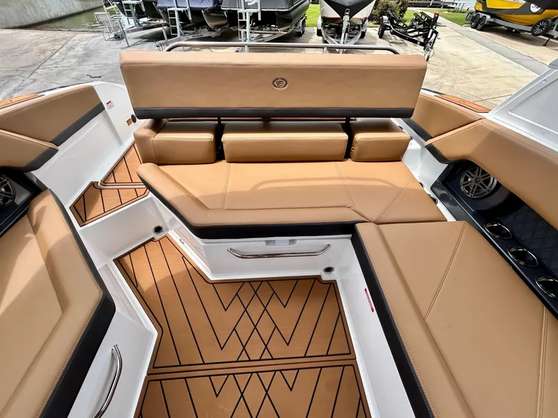 Slide: The Image of The image shows the cockpit of a Cobalt R4 boat with beige upholstery and modern design. - 48